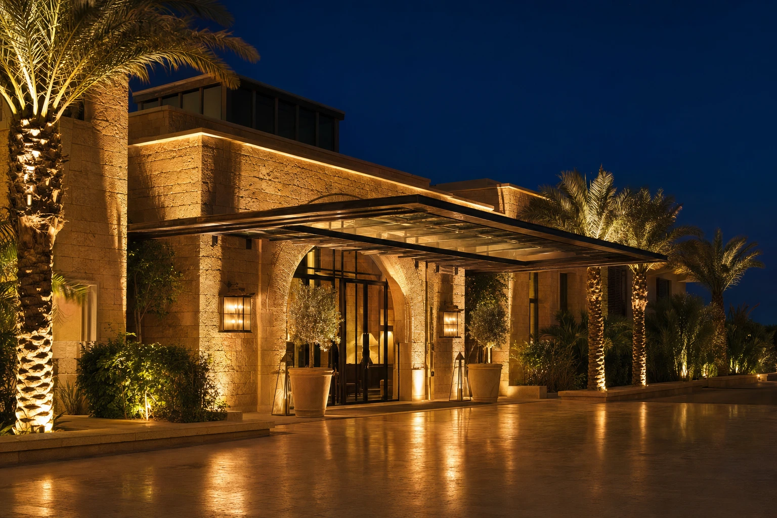 The lit entrance of the resort at night